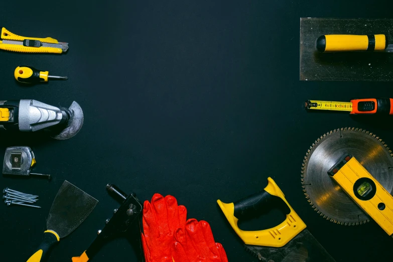 a variety of tools laid out on a table, trending on pexels, bauhaus, black and yellow and red scheme, [ metal ], black, prop