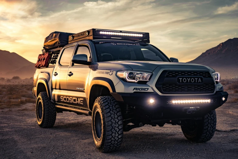 a toyota tacoma is parked in the desert, a portrait, unsplash, led light strips, 3 - piece, slim build, black