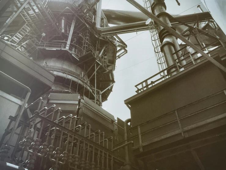 a black and white photo of a factory, an album cover, unsplash, brutalism, autochrome photograph, steel mill, charles sheeler, close-up photograph