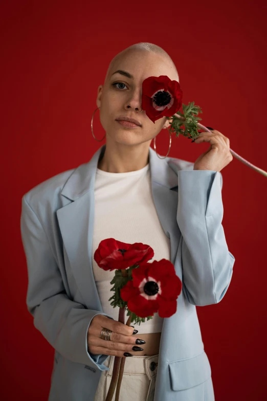 a woman holding a bunch of flowers in front of her face, an album cover, pexels contest winner, antipodeans, portrait of bald, poppy, portrait full body, maxim sukharev