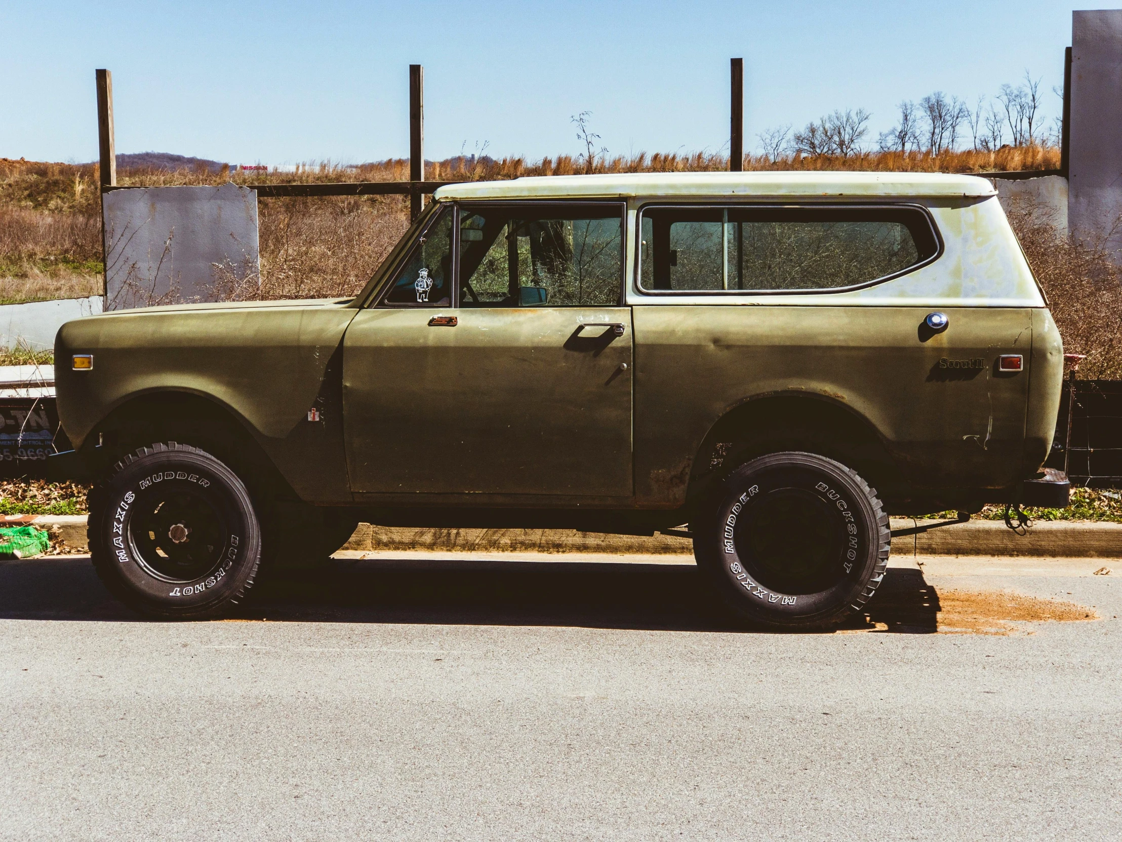 an old green truck parked on the side of the road, pexels contest winner, renaissance, humvee, green and brown clothes, southern slav features, instagram post