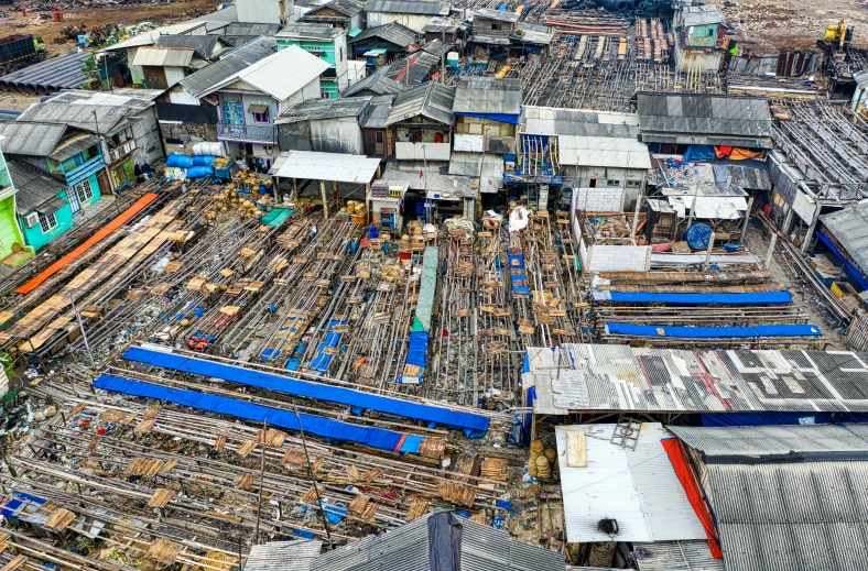 a lot of buildings that are next to each other, pexels contest winner, photorealism, fish seafood markets, manila, peaked wooden roofs, construction site