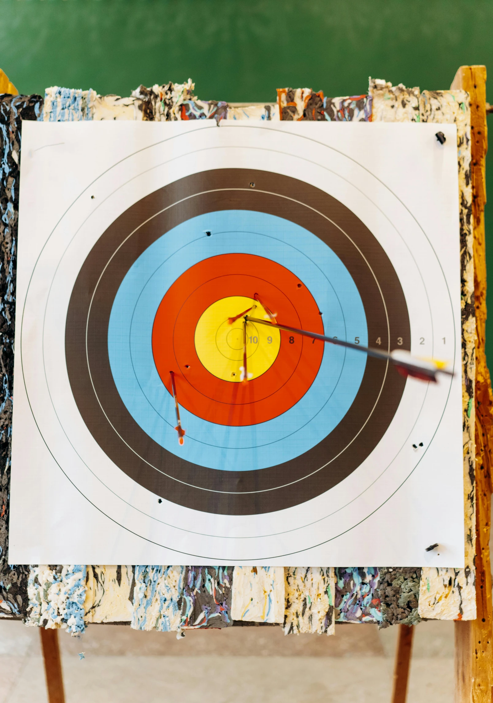 an arrow is in the center of a target, inspired by Kenneth Noland, pexels contest winner, sports photo, getty images, on wood, large format