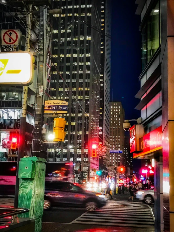 a city street filled with lots of traffic at night, a picture, toronto city, street signs, high quality image, photographs