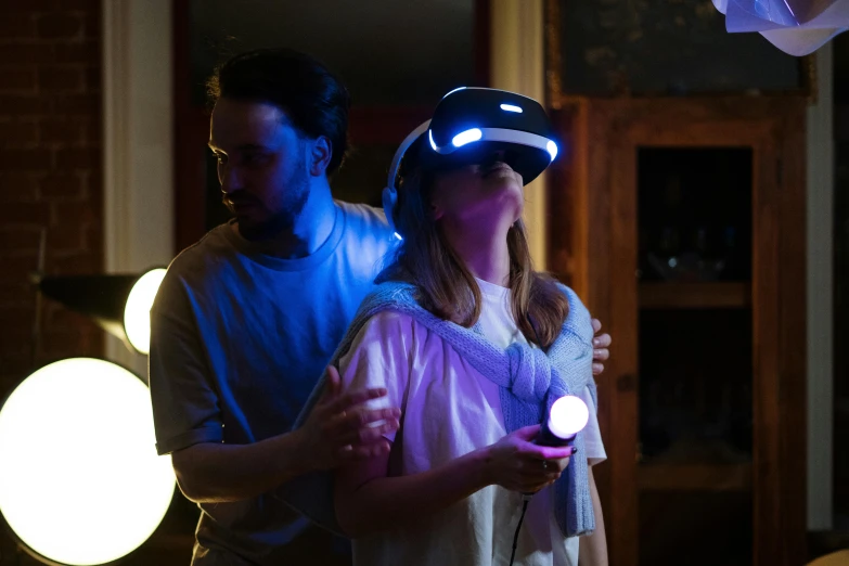 a man and woman standing next to each other in a living room, a hologram, inspired by Jules Chéret, unsplash, interactive art, gaming headset, blindfolded, shot with sony alpha, rey