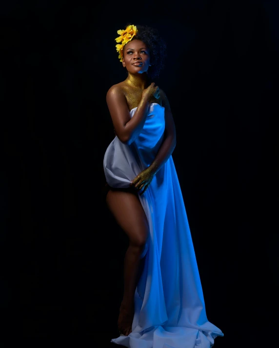a woman in a blue dress with a flower in her hair, an album cover, inspired by Jean-Auguste-Dominique Ingres, unsplash, black skin, full length photo, bathed in the the glow, fashion shoot 8k