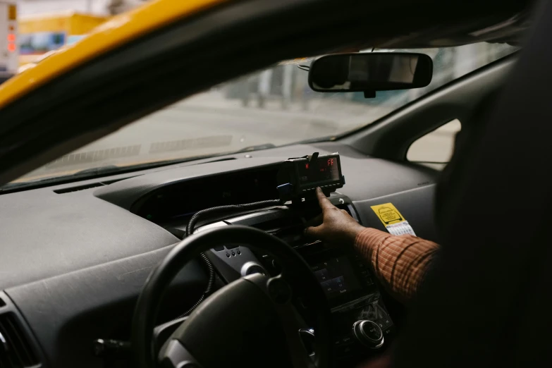 a close up of a person driving a car, square, taxi, unsplash photography, ad image