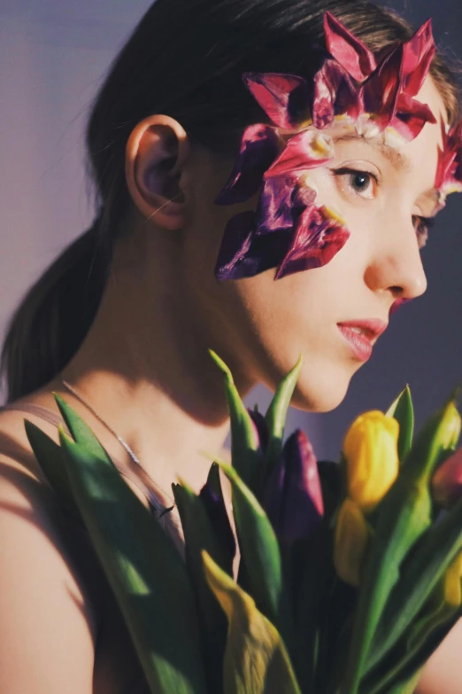 a girl with flowers painted on her face, an album cover, trending on pexels, video still, ekaterina, iris, still from film