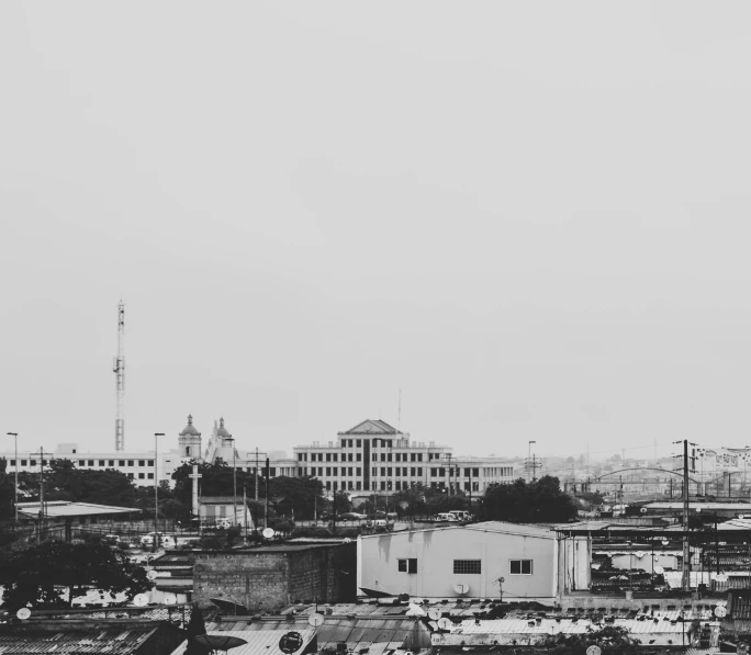 a black and white photo of a city, by Ismail Acar, indore, high quality upload, white buildings, desaturated