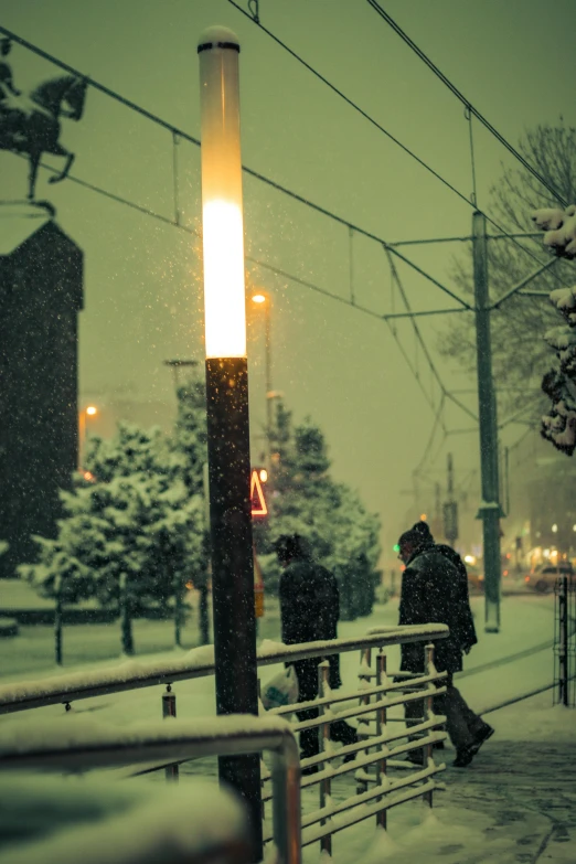 a couple of people that are walking in the snow, inspired by Elsa Bleda, conceptual art, streetlamp, chillhop, trending photo