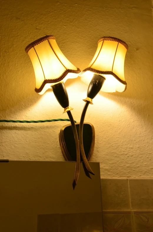 a couple of lamps that are on a wall, an album cover, by Hans Schwarz, flickr, hotel room, taken in the early 2020s, closeup - view, good quality lighting