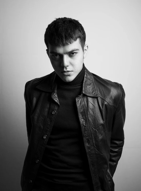 a black and white photo of a man in a leather jacket, by Alexander Litovchenko, rex orange county, a handsome man，black short hair, magnus carlsen, promotional image