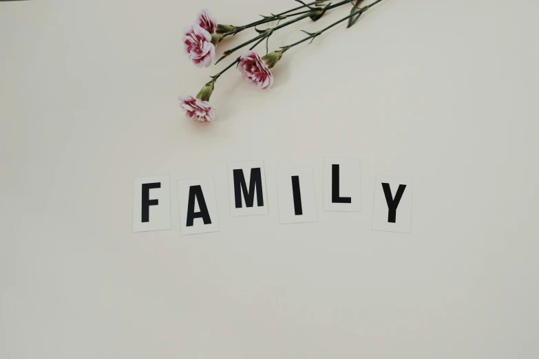 a piece of paper with the word family written on it, by The Family Circus, unsplash, flower, wall art, ffffound, tarantino