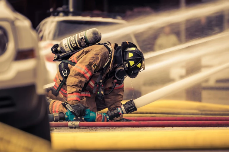 a firefighter using a hose to put out a fire, by Dan Luvisi, pexels contest winner, cinematic photo 4k, sport photography, ilustration, cute photo