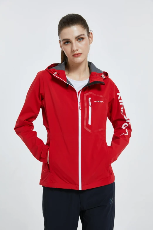 a woman wearing a red jacket and black pants, sleek waterproof design, reluvy5213, logo, ƒ5.6