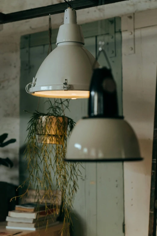 a couple of lamps sitting on top of a wooden table, by Jan Tengnagel, unsplash, light and space, industrial art style, light inside the hut, enamel, photo of a model