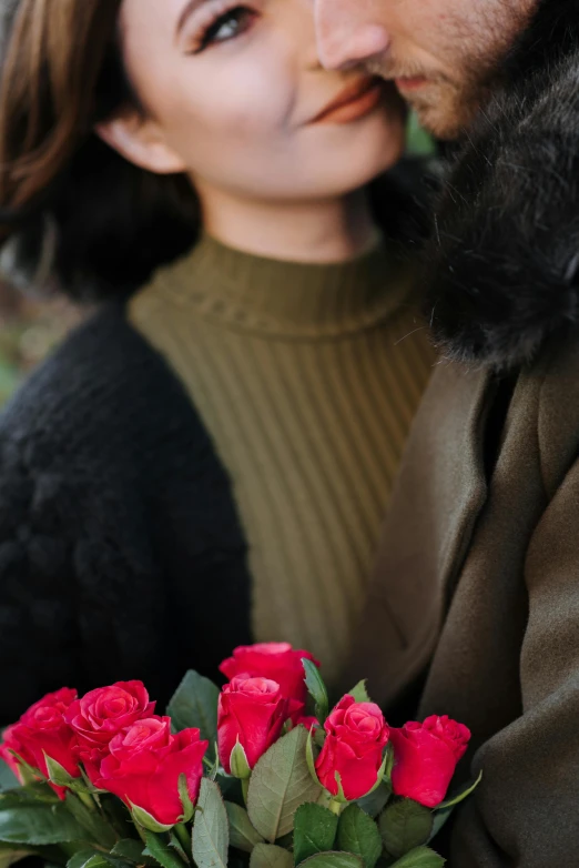 a man holding a bouquet of red roses next to a woman, by Julia Pishtar, trending on unsplash, wearing a turtleneck and jacket, girl with dark brown hair, dark. no text, asian women