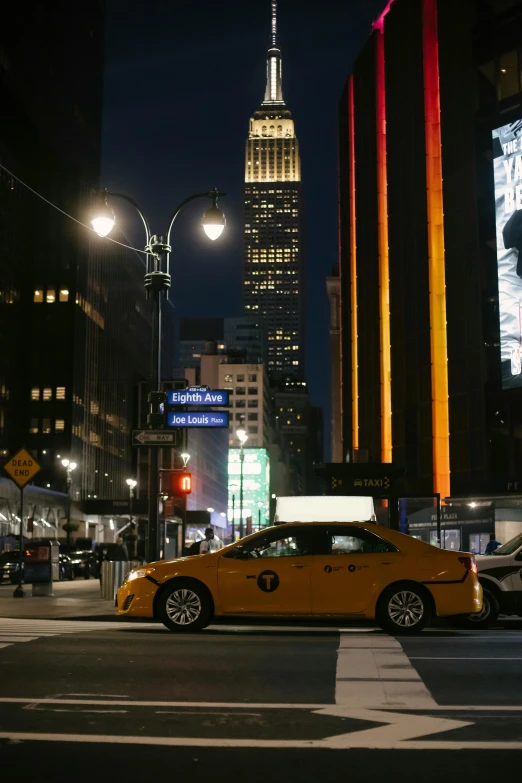 a yellow taxi driving down a street next to tall buildings, nighttime foreground, madison square garden, promo image, stacked image