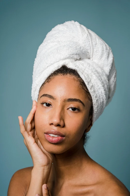 a woman with a towel on her head, by Carey Morris, trending on pexels, renaissance, ashteroth, plain background, promo image, manicured
