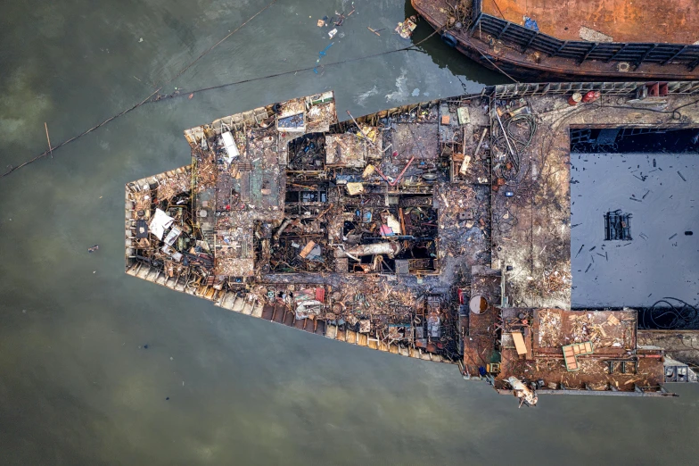 an aerial view of a ship in the water, by Joseph Severn, unsplash contest winner, conceptual art, building destroyed, guangjian huang, annie leibowitz, close portrait