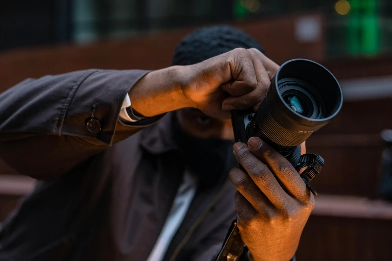 a man taking a picture with a camera, a picture, inspired by Gordon Parks, pexels contest winner, portrait of a vigilante, sigma 85mm f1.4 dg dn, mana shooting from his hands, 35mm —w 1920 —h 1080