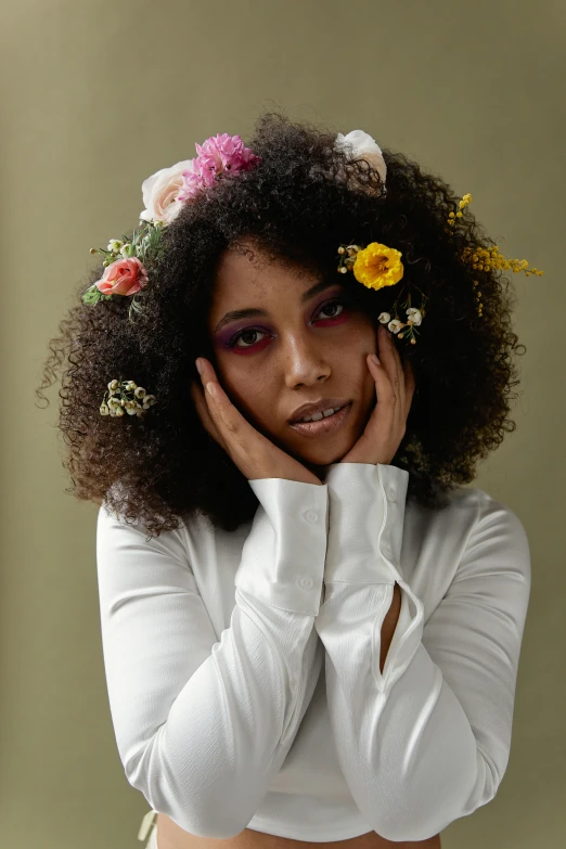 a woman with a flower crown on her head, an album cover, trending on pexels, mixed race, lovingly looking at camera, pressed flowers, curls