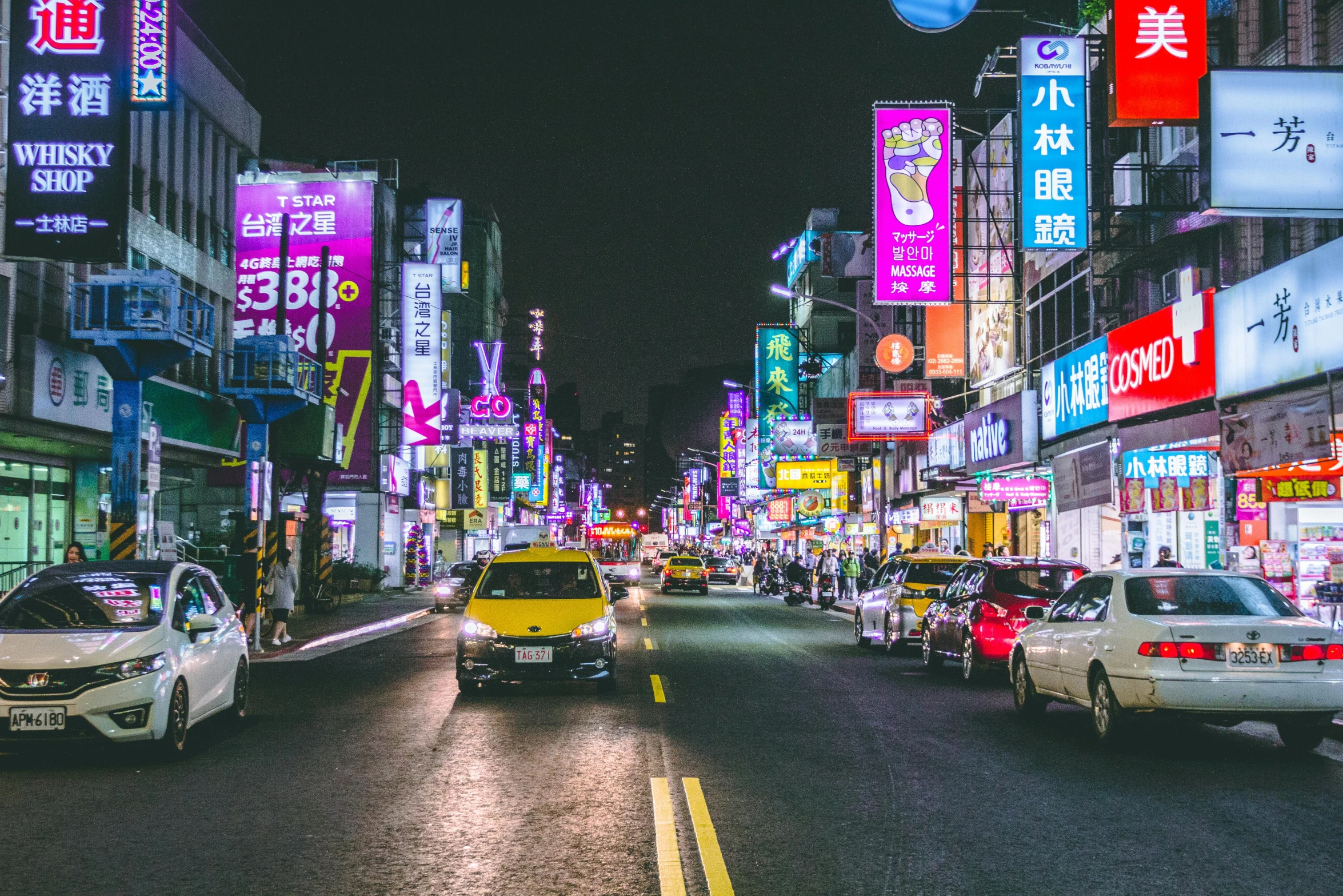 a city street filled with lots of traffic at night, pink yellow and blue neon signs, taiwan, unsplash photography, square