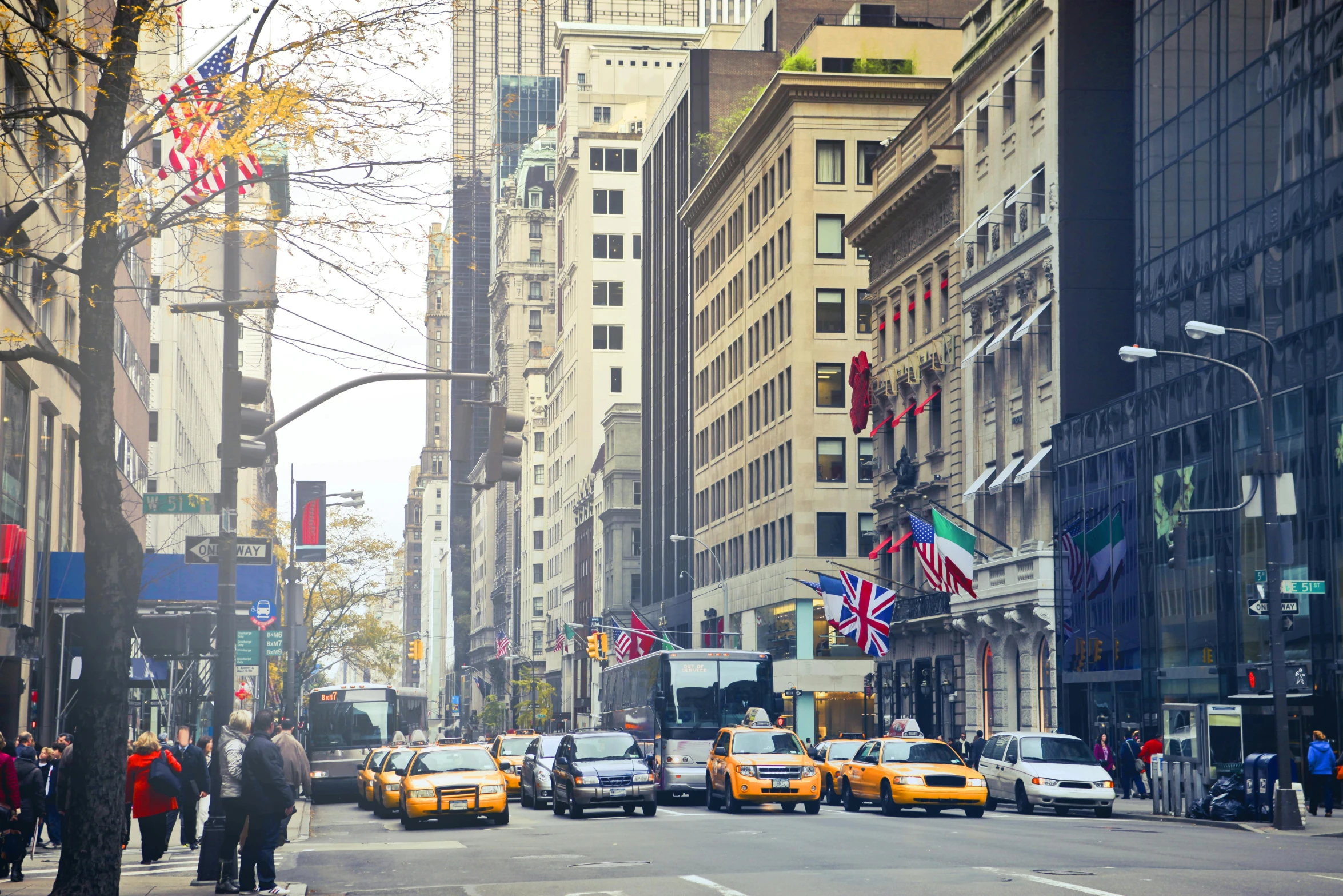 a busy city street filled with lots of traffic, a photo, new york buildings, thumbnail, an elegant, slide show