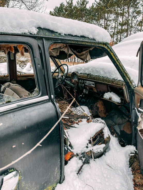 an old car that is sitting in the snow, by Jaakko Mattila, pexels contest winner, auto-destructive art, wide shot of a cabin interior, detailed color scan”, nuclear aftermath, dressed in a worn