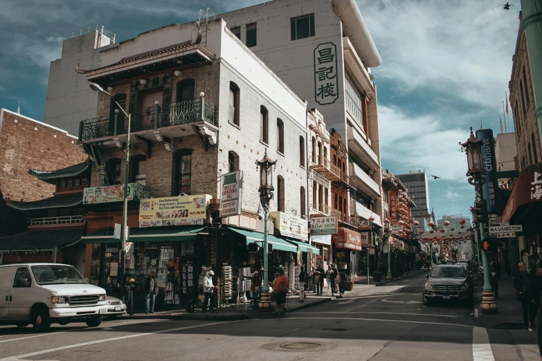 a group of people walking down a street next to tall buildings, chinatown, background image, old shops, bay area