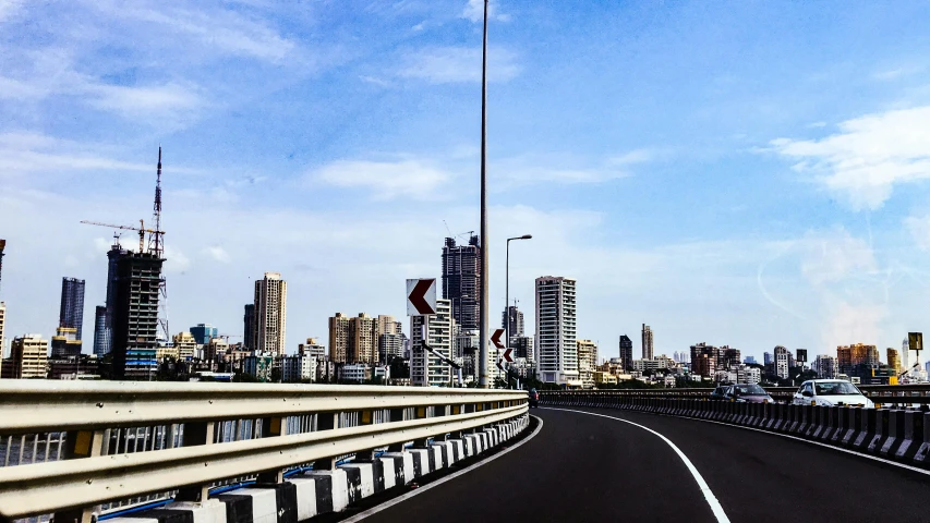 a view of a city from a highway, an album cover, pexels contest winner, hyperrealism, streets of mumbai, bridge, sky line, medium format