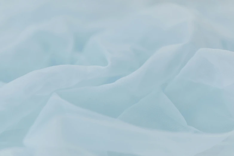 a close up of a bed covered in white sheets, a macro photograph, unsplash, cyan fog, 8k fabric texture details, chiffon, solid colours material