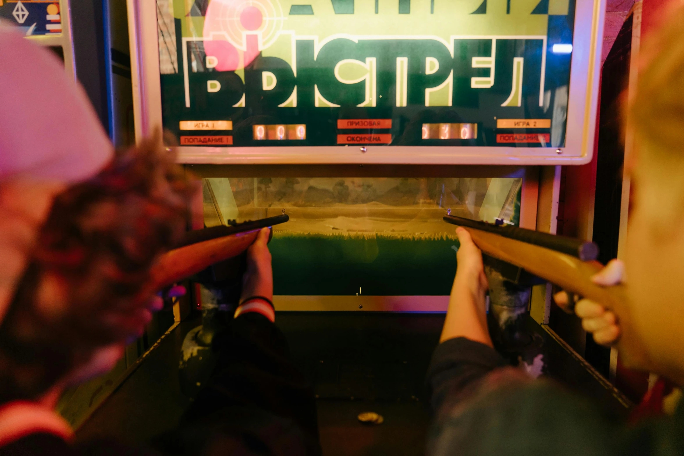 a couple of people playing a video game, unsplash, private press, bottom view ， bladerunner, soviet nostalgia, bowling, guillotine rgb