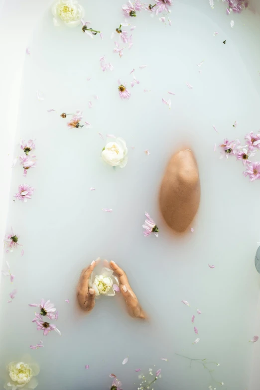 a close up of a person in a bath tub with flowers, soft shapes, chocolate, made purely out of water, photoshoot
