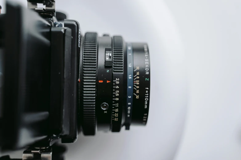 a close up of a camera lens on a tripod, a macro photograph, unsplash, hasselblad medium format, minimal. sharp focus, arriflex lens, aperture f/9