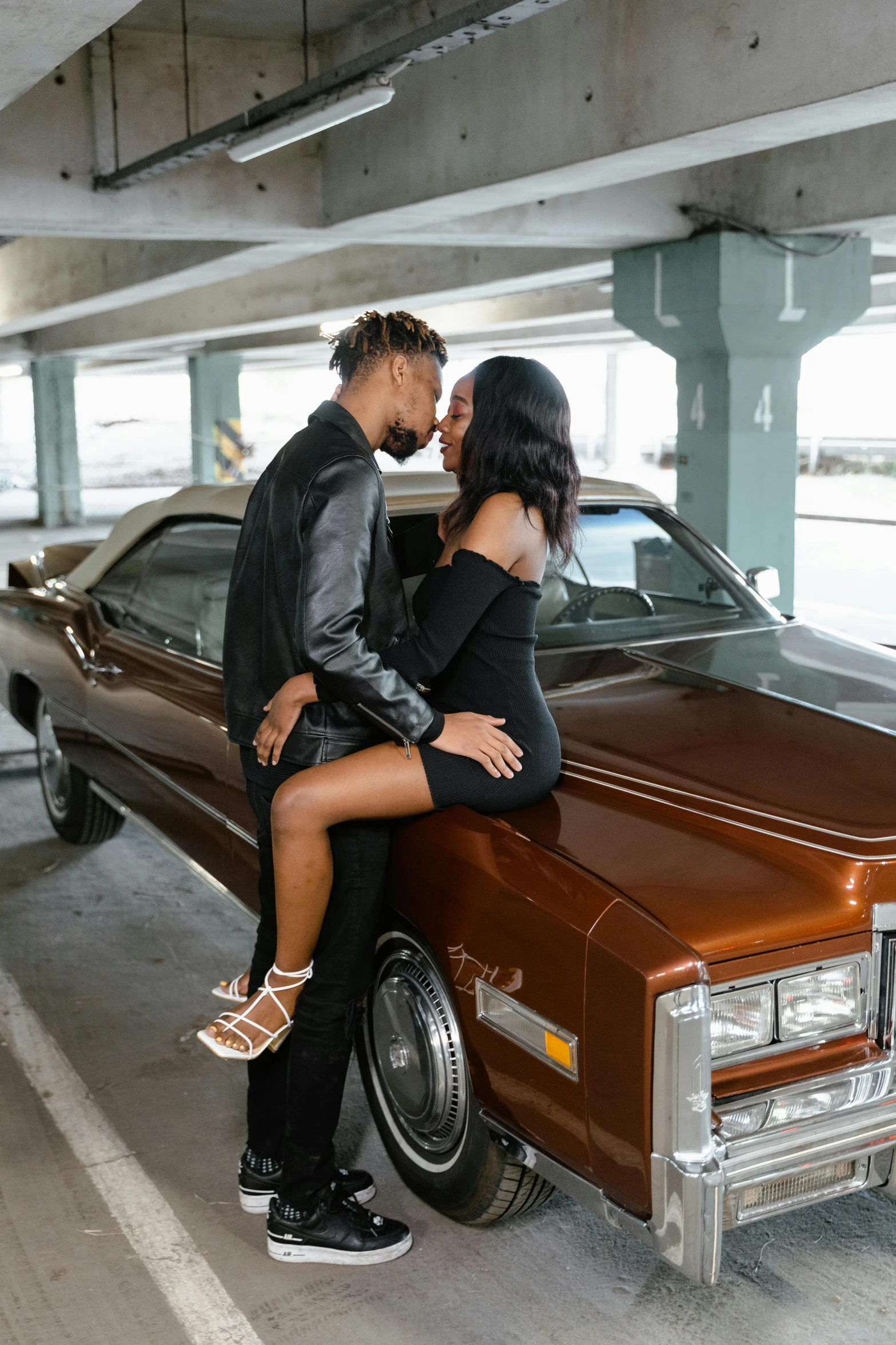 a man and a woman sitting on top of a car, trending on pexels, essence, romantic lead, standing in front of lowrider, rectangle