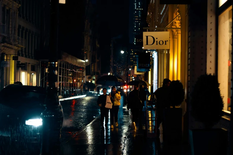 a group of people walking down a street at night, by Adam Rex, pexels contest winner, visual art, dior campaign, day after raining, on madison avenue, shops