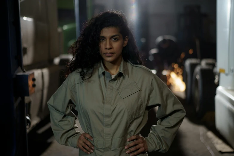 a woman standing with her hands on her hips, by Jason Felix, air force jumpsuit, imaan hammam, worksafe. cinematic, charli bowater