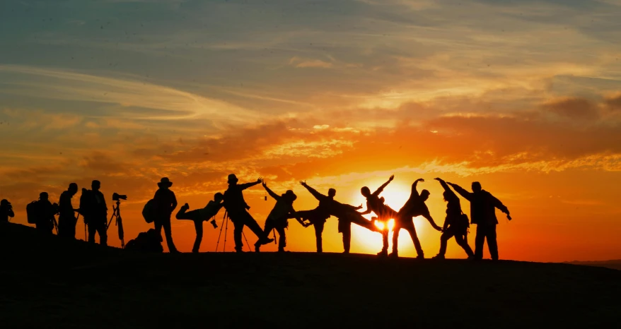 a group of people standing on top of a hill, pexels contest winner, figuration libre, capoeira, sunset panorama, avatar image