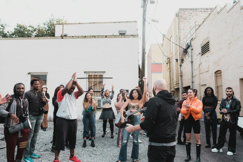 a group of people standing on top of a street, unsplash, happening, te pae, dance scene, in an alley, charli bowater and artgeem