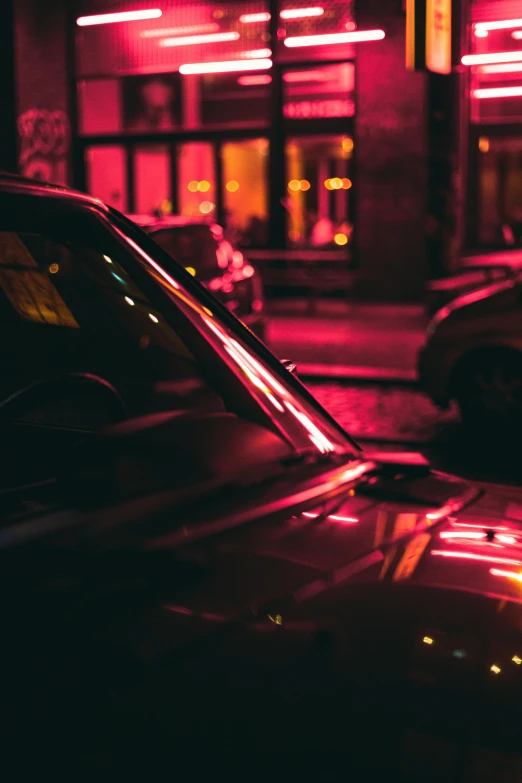 a couple of cars parked next to each other on a street, by Adam Marczyński, soft red lights, neon and dark, cinematic closeup, multiple stories