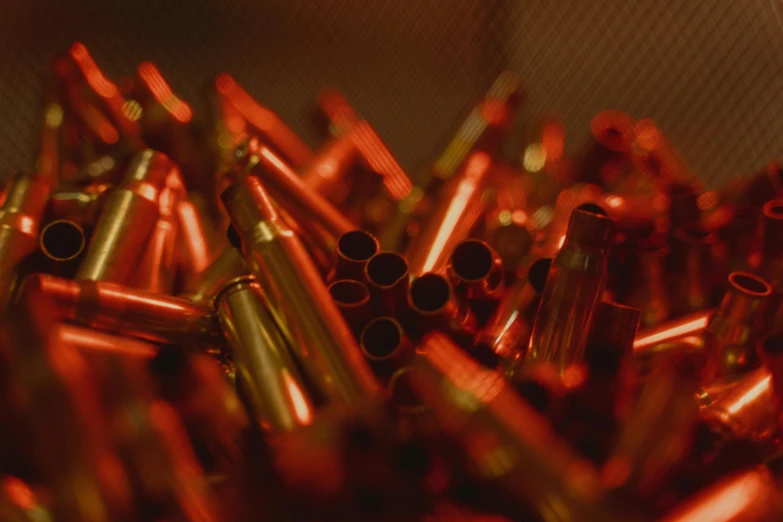 a close up of a bunch of red bullet casings, pexels contest winner, process art, flares anamorphic, copper and brass, thumbnail, digital image