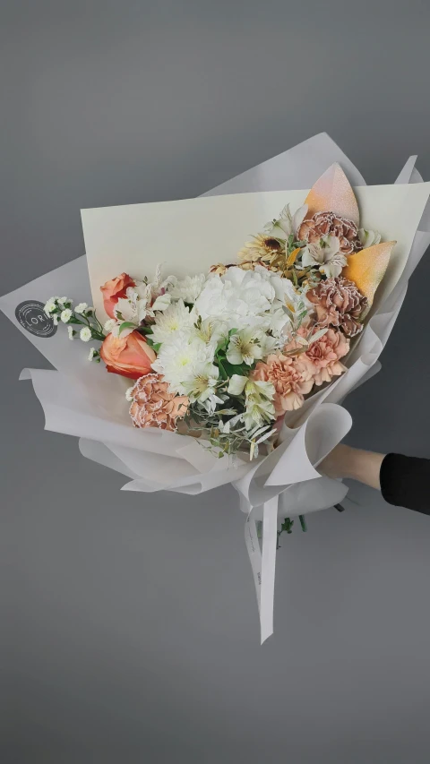 a woman is holding a bouquet of flowers, inspired by François Boquet, unsplash, white and orange, diecut, angle view, wrapped in flowers