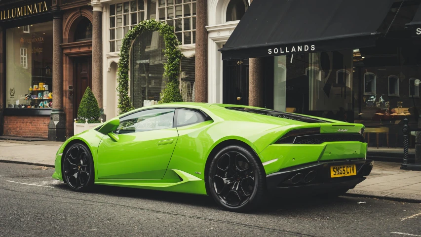 a green sports car parked on the side of the road, by Daniel Seghers, pexels contest winner, renaissance, bold lamborghini style, 🐿🍸🍋, london, delightful surroundings
