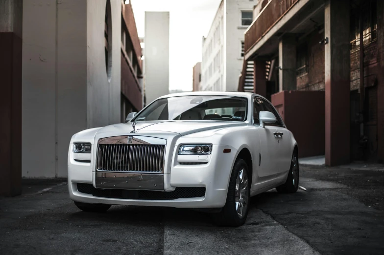 a white rolls royce parked in front of a building, by Alexander Robertson, pexels contest winner, renaissance, square, inside of a car, white pearlescent, thumbnail