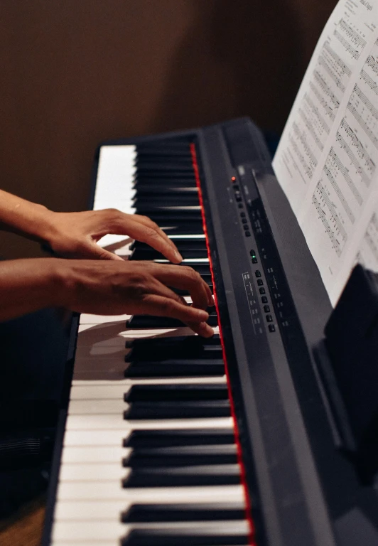 a close up of a person playing a piano, trending on unsplash, getty images, multiple stories, taken in the late 2000s, panels