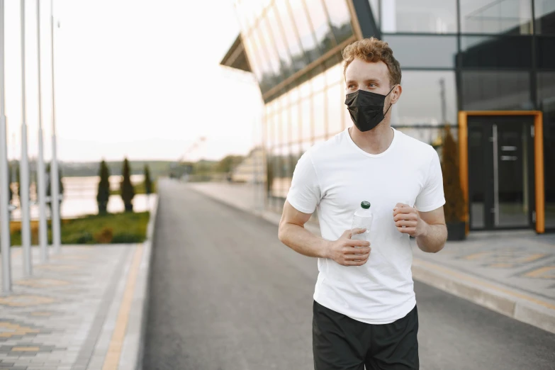 a man running down a street wearing a face mask, a picture, hydration, blank, diy, thumbnail