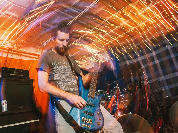 a man that is playing a guitar in a room, synchromism, spiderman in the moshpit, profile image, harsh flash photo, warped