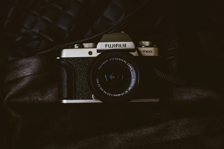 a black and white photo of a camera, inspired by Elsa Bleda, unsplash contest winner, photorealism, fujifilm, cinematic outfit photo, furry shot, medium format color photography