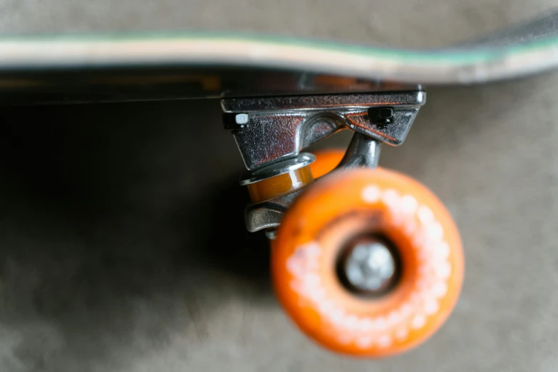 a close up of a skateboard with orange wheels, a picture, by Dan Christensen, pexels contest winner, micro detail, 15081959 21121991 01012000 4k, tiny details, instagram photo